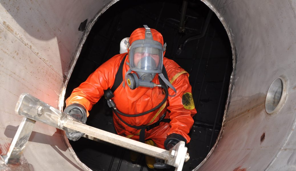 man in chemical suit